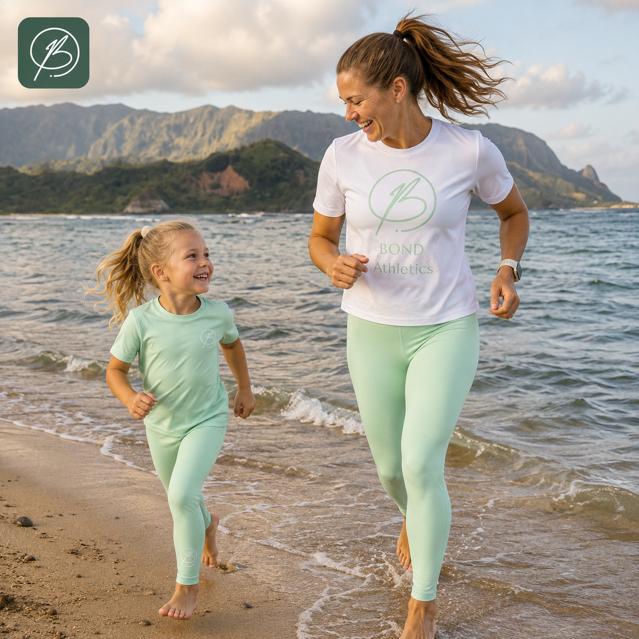 A woman and a young girl running on a sandy beach at the water's edge, wearing matching mint green athletic sets. The woman wears a white t-shirt with a green 'Bond Athletics' logo and mint green leggings, while the girl wears a matching mint green t-shirt and leggings.