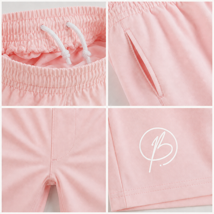 A four-panel close-up collage of light pink shorts, showing the elastic drawstring waistband, a side pocket, the front seam, and a white stylized logo printed on the leg.